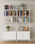 Contemporary all-white two-bay home bookshelf storage unit.